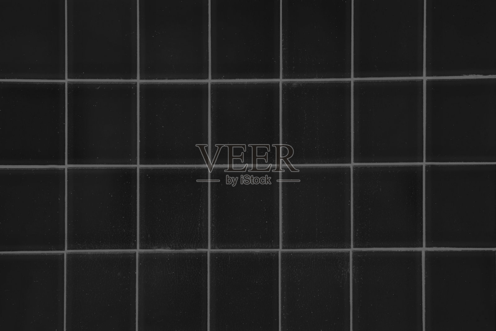 黑色方形瓷砖背景，单色淋浴或地板，特写照片摄影图片
