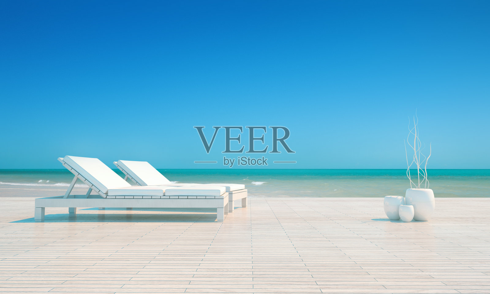 两把躺椅，豪华旅游度假区，热带海滩，明亮的灯光照片摄影图片