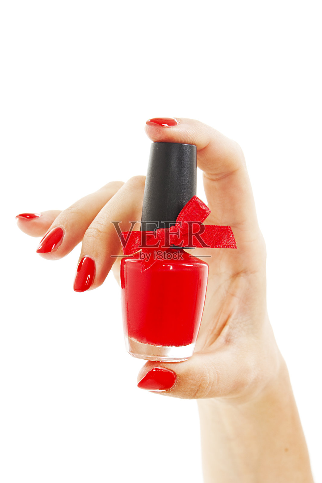女人的手和一瓶红色指甲油照片摄影图片