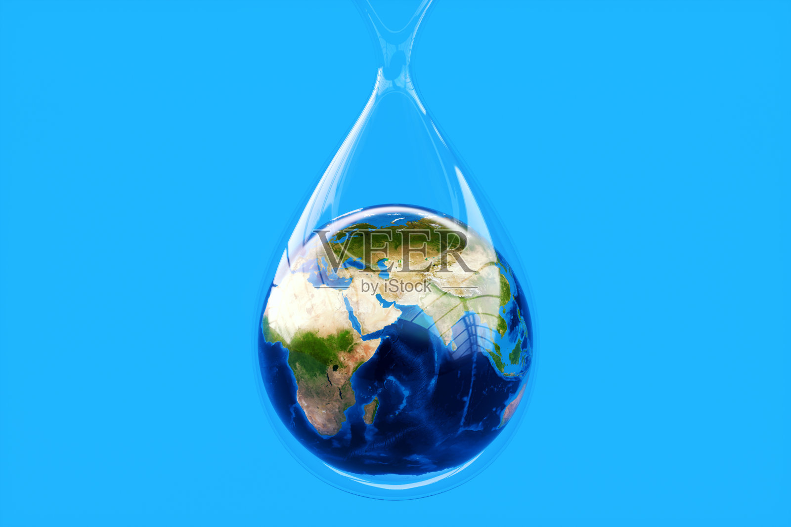 地球仪内一滴水挂在蓝色背景上照片摄影图片