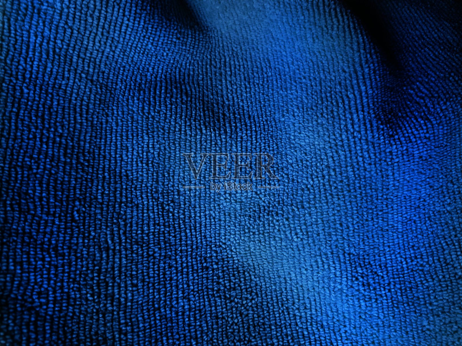 蓝色的织物。照片摄影图片