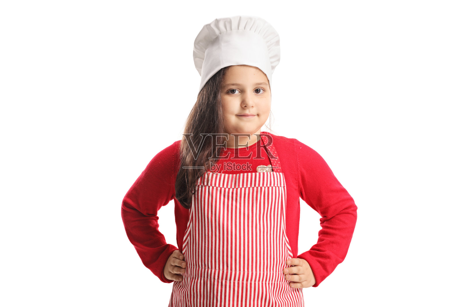 小女孩穿着围裙，戴着烹饪帽照片摄影图片