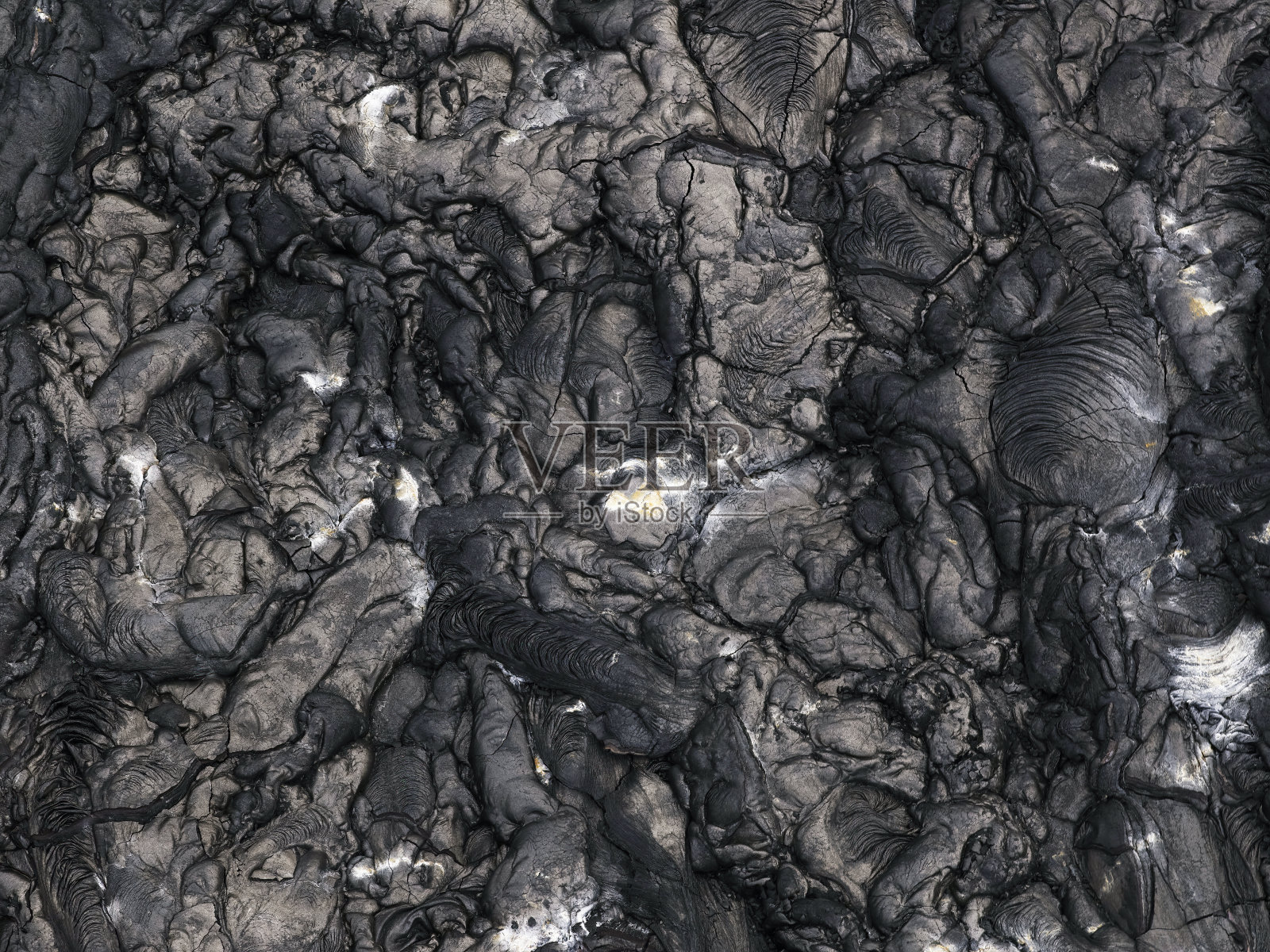 凝固熔岩背景。抽象结构照片摄影图片