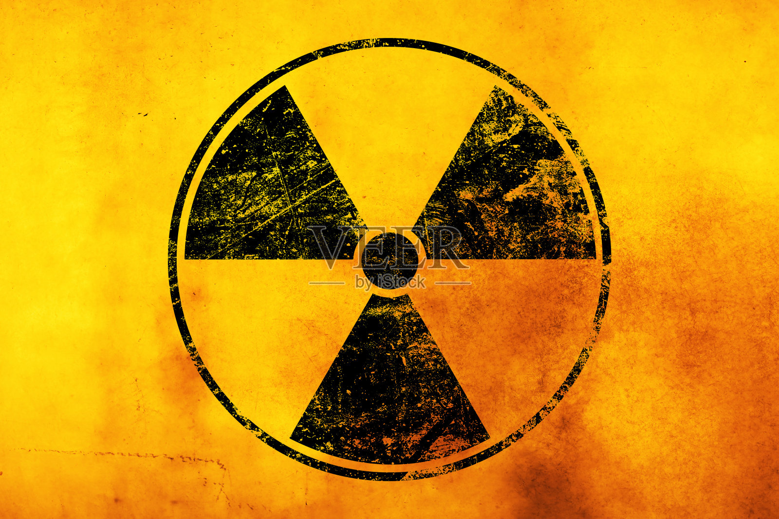黄色背景上的黑色放射性标志照片摄影图片