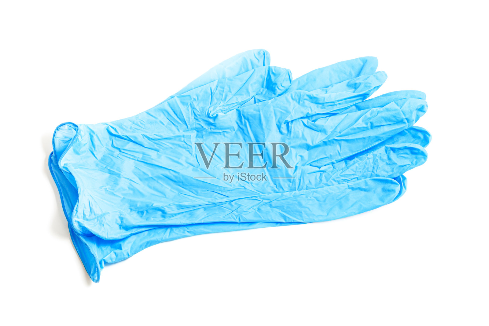 一双白色背景的蓝色医用乳胶手套。照片摄影图片