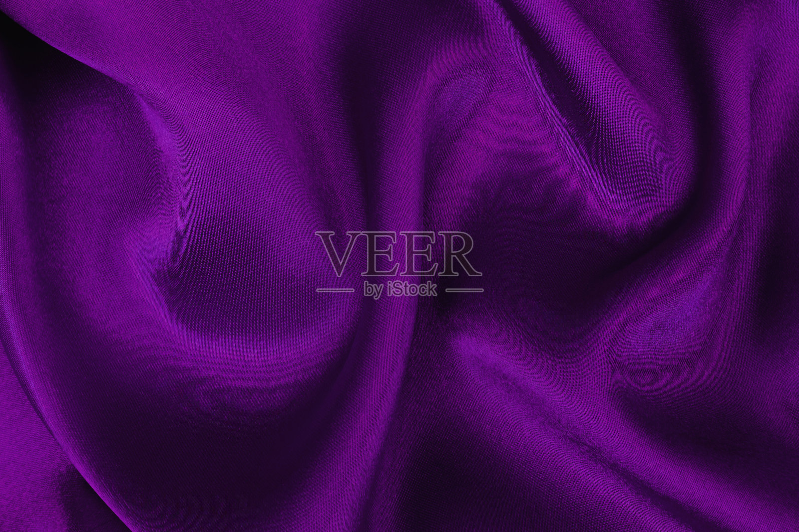 紫色面料布料质地为背景和设计艺术作品，美丽的褶皱图案的丝绸或亚麻。照片摄影图片
