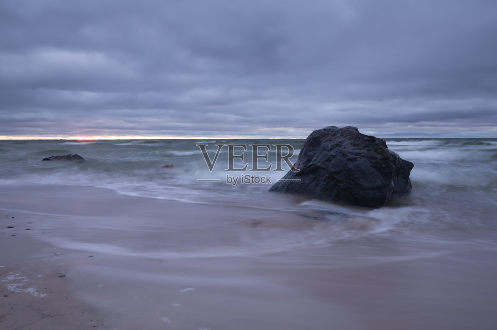 波罗的海的日落与长时间曝光照片摄影图片