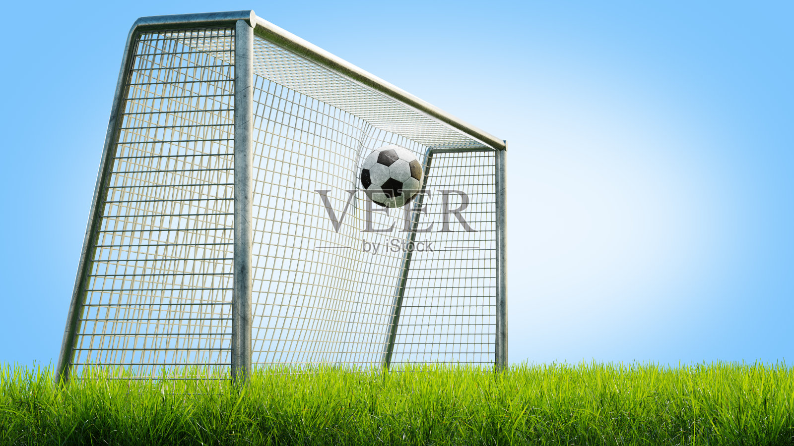 草地上球门里的足球。球在蓝色背景上击中了球门。足球在球门里，3d渲染照片摄影图片