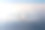 飞机飞越云和阿尔卑斯山上的夕阳。前面素材图片