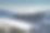 波兰巴比亚戈拉，阳光明媚的雪林林间空地和朦胧的山脉素材图片